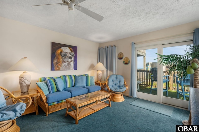 117 Sea Colony Dr Unit 211B, Duck, NC 27949 - carpeted living area with a ceiling fan and a textured ceiling