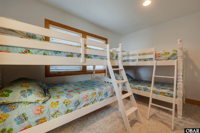 carpeted bedroom with baseboards