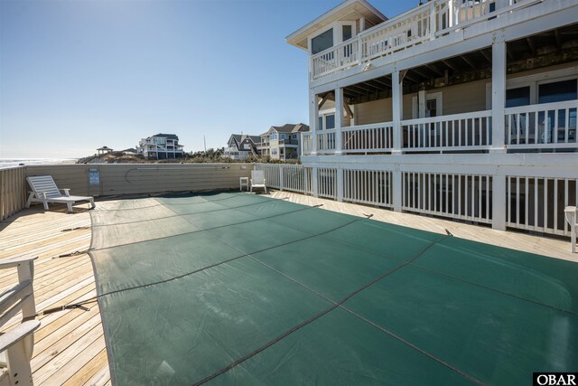 view of swimming pool featuring a deck