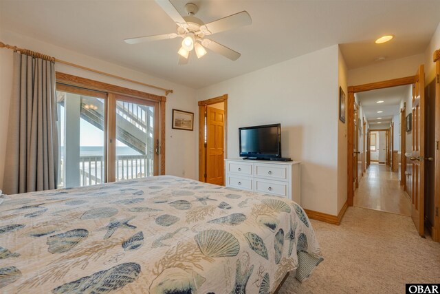 bedroom with ceiling fan, access to exterior, baseboards, and light carpet