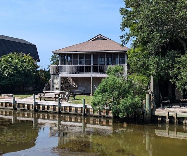 52 Fish Camp Lane Lot# 94& P95, Ocracoke, NC 27960 - rear view of house with a sunroom, stairway, roof with shingles, and a deck with water view