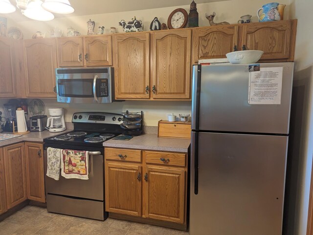 52 Fish Camp Lane Lot# 94& P95, Ocracoke, NC 27960 - kitchen featuring stainless steel appliances, light countertops, and brown cabinets