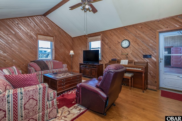 278 Bayview Dr, Stumpy Point, NC 27978 - living room featuring a ceiling fan, wooden walls, wood finished floors, and vaulted ceiling