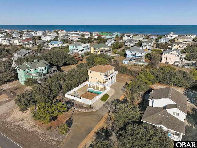 aerial view featuring a water view and a residential view