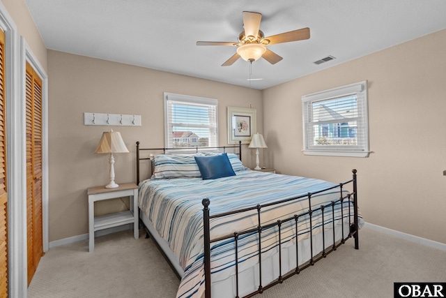 bedroom featuring carpet, a closet, visible vents, and baseboards