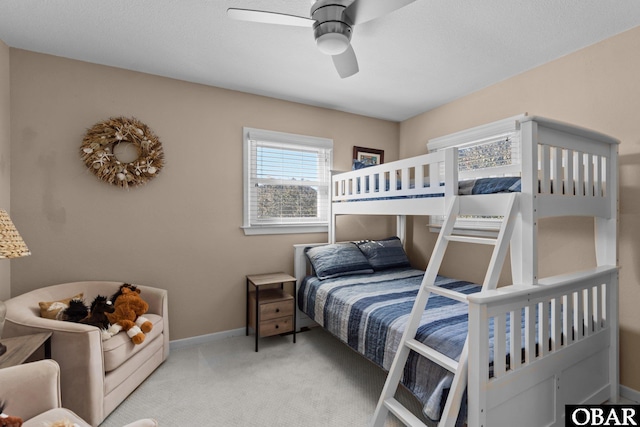 bedroom featuring a ceiling fan, carpet, and baseboards