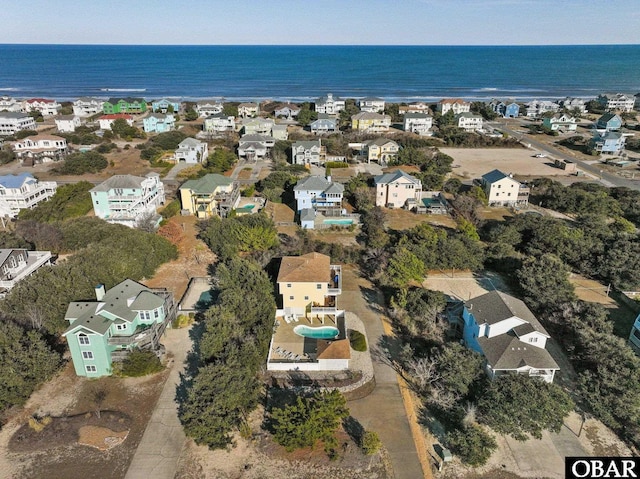 birds eye view of property featuring a water view and a residential view