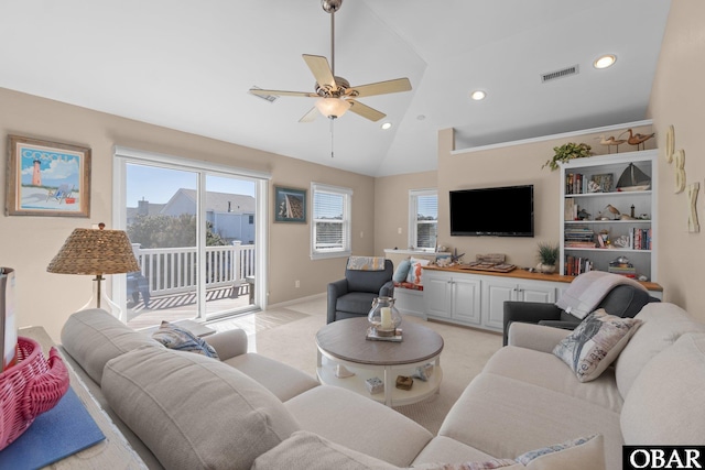 living room with recessed lighting, visible vents, a ceiling fan, light carpet, and vaulted ceiling