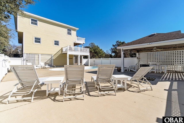 view of patio featuring stairway and a fenced backyard