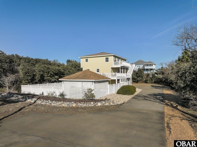 view of front of home with fence