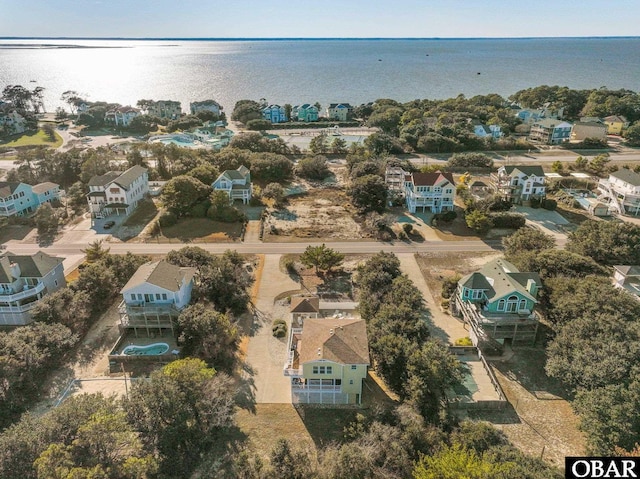 birds eye view of property featuring a residential view and a water view