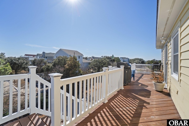 wooden terrace with area for grilling