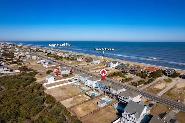 aerial view with a water view, a residential view, and a view of the beach