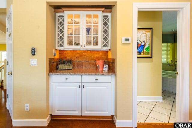 1129 Morris Dr Lot 735, Corolla, NC 27927 - indoor dry bar featuring baseboards, backsplash, healthy amount of natural light, and light tile patterned floors