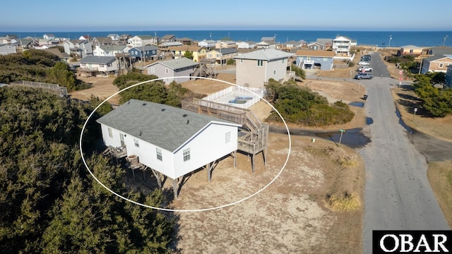 aerial view featuring a residential view and a water view