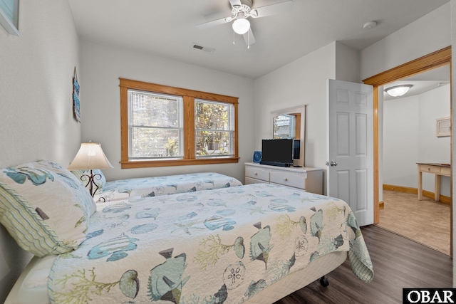 107 W Gray Eagle St Unit 103A, Nags Head, NC 27959 - bedroom with wood finished floors and ceiling fan