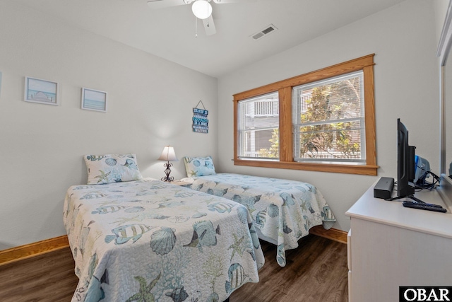 107 W Gray Eagle St Unit 103A, Nags Head, NC 27959 - bedroom featuring dark wood finished floors and a ceiling fan