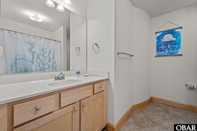 107 W Gray Eagle St Unit 103A, Nags Head, NC 27959 - bathroom featuring vanity and tile patterned flooring