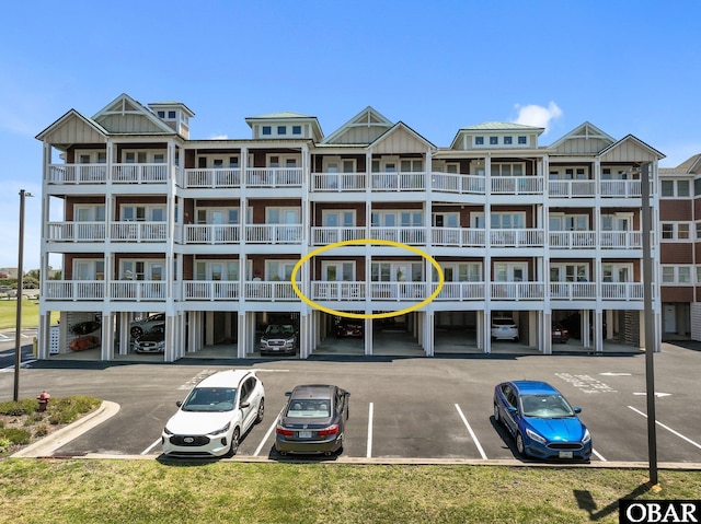 107 W Gray Eagle St Unit 103A, Nags Head, NC 27959 - view of apartment building / complex featuring uncovered parking