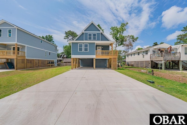 224 W Lost Colony Dr Lot 13, Nags Head, NC 27959 - beach home with stairs, driveway, a front lawn, a carport, and covered porch