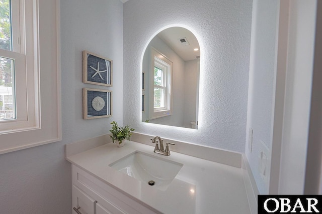 224 W Lost Colony Dr Lot 13, Nags Head, NC 27959 - bathroom featuring a textured wall and vanity