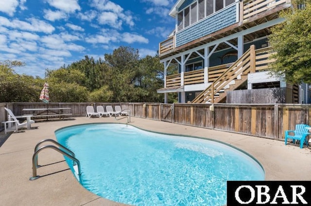740 E Willet Ct Lot 54, Corolla, NC 27927 - view of swimming pool with a fenced in pool, fence, a patio, and stairway