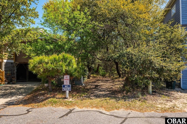 740 E Willet Ct Lot 54, Corolla, NC 27927 - view of yard with driveway and a carport