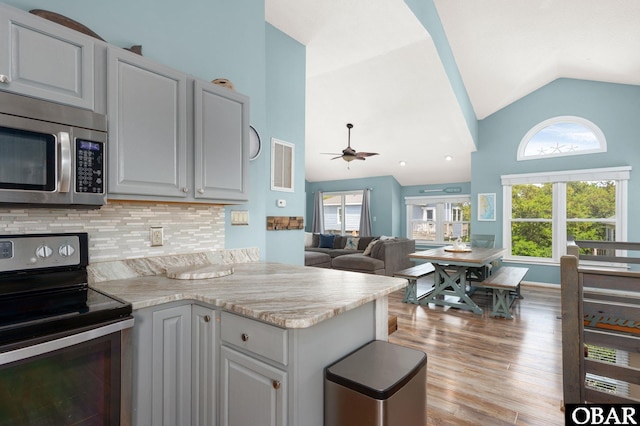 740 E Willet Ct Lot 54, Corolla, NC 27927 - kitchen with ceiling fan, appliances with stainless steel finishes, light countertops, a peninsula, and visible vents