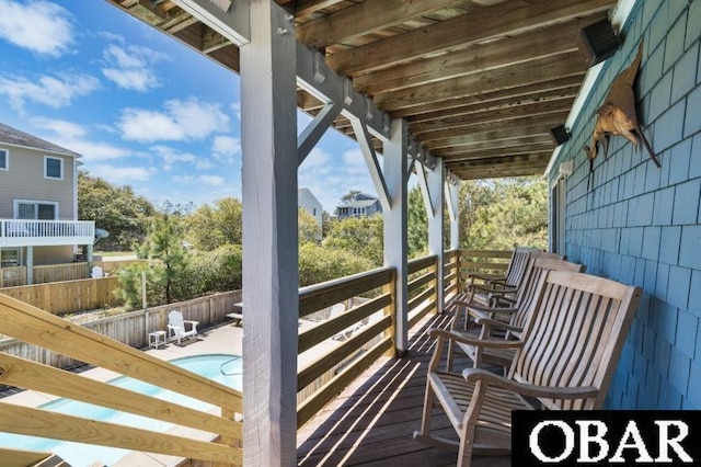 740 E Willet Ct Lot 54, Corolla, NC 27927 - deck featuring a fenced in pool and fence