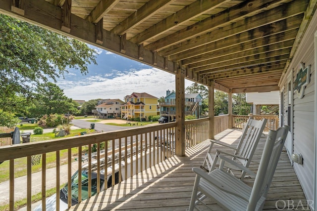 wooden terrace featuring a residential view