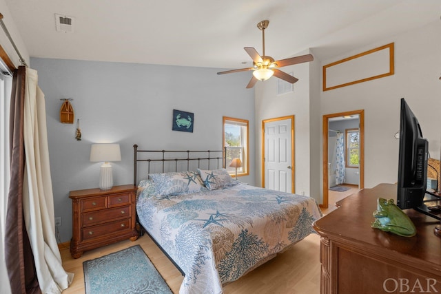 bedroom featuring light wood finished floors, multiple windows, and visible vents