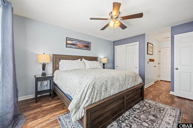 813 Pirates Way Unit 813, Manteo, NC 27954 - bedroom featuring a closet, baseboards, wood finished floors, and a ceiling fan