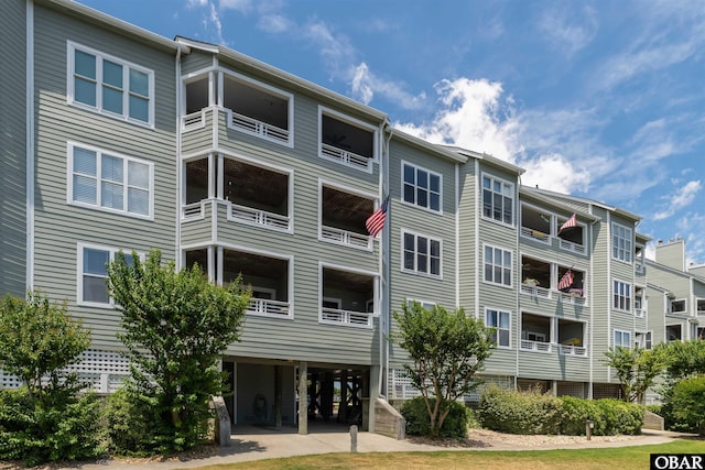 813 Pirates Way Unit 813, Manteo, NC 27954 - view of apartment building / complex featuring a carport