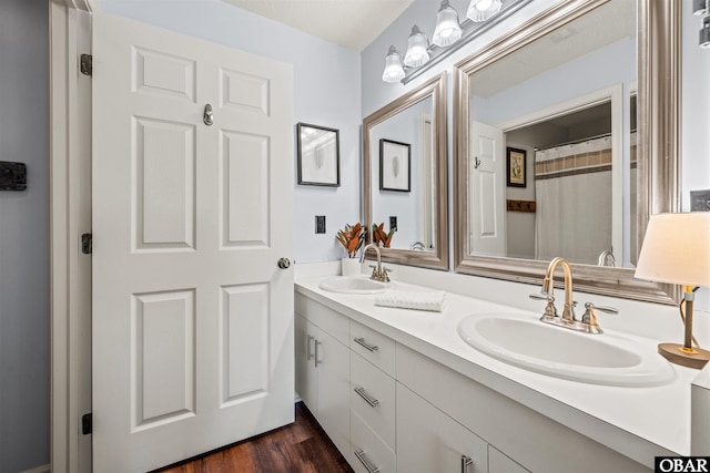 813 Pirates Way Unit 813, Manteo, NC 27954 - bathroom featuring double vanity and wood finished floors