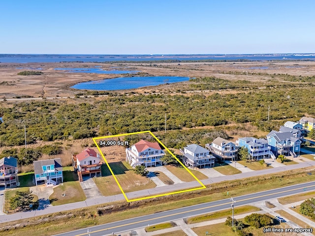 bird's eye view with a water view and a residential view