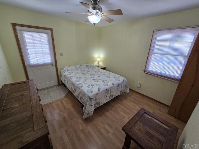 bedroom featuring light wood-style flooring and a ceiling fan