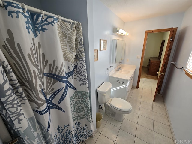 full bath featuring curtained shower, vanity, toilet, and tile patterned floors