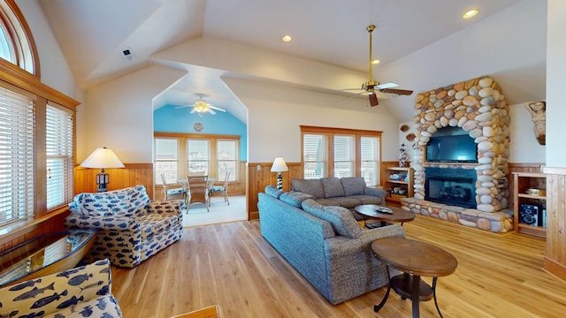 46065 Cape Point Way Lot 58, Buxton, NC 27920 - living area with ceiling fan, vaulted ceiling, wainscoting, a stone fireplace, and wood finished floors