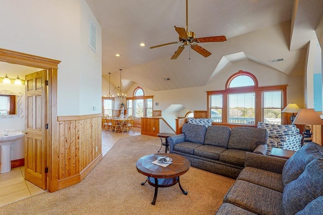 46065 Cape Point Way Lot 58, Buxton, NC 27920 - living room with a ceiling fan, a wainscoted wall, light tile patterned floors, a chandelier, and arched walkways