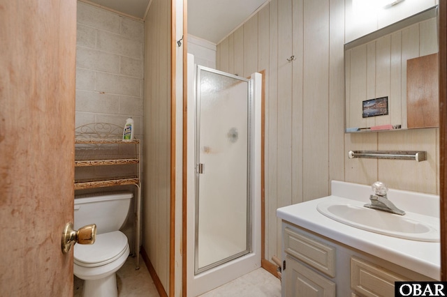 full bath featuring toilet, vanity, and a stall shower