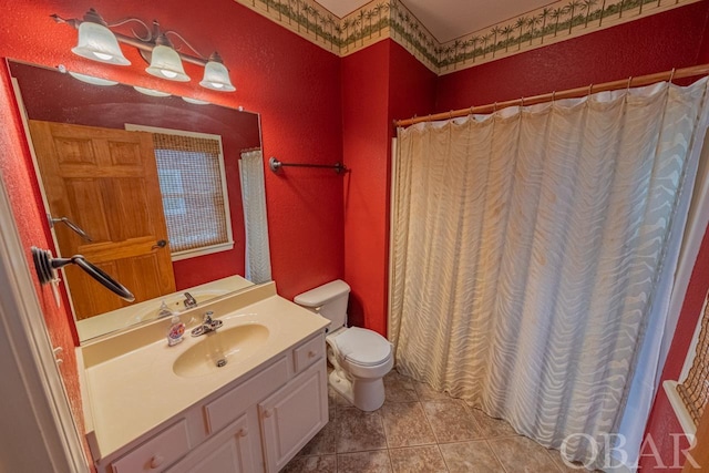 full bath featuring toilet, tile patterned flooring, vanity, and a shower with curtain