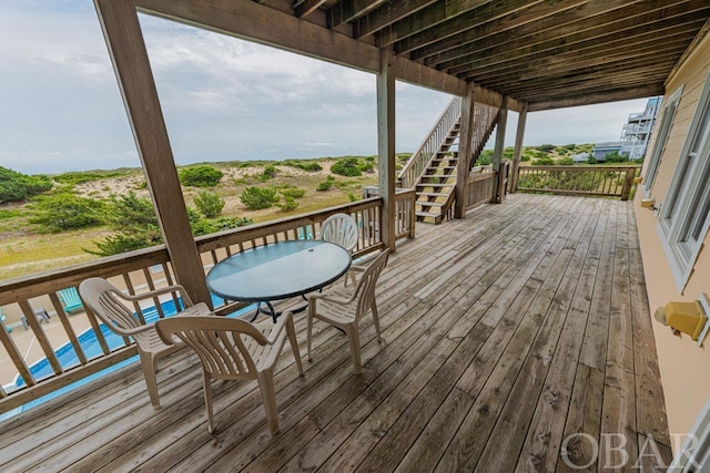 wooden terrace featuring stairs