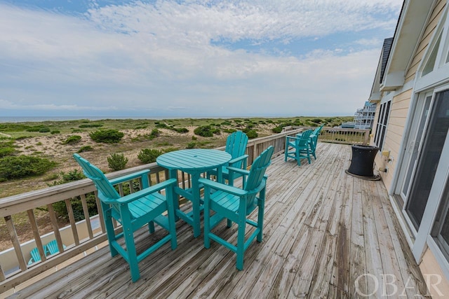 deck with outdoor dining area