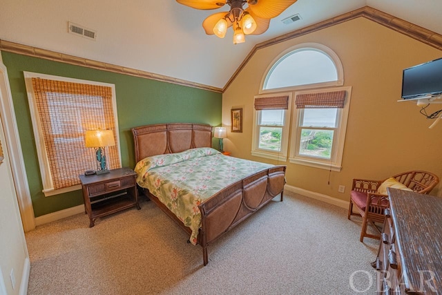 bedroom featuring lofted ceiling, baseboards, visible vents, and light colored carpet