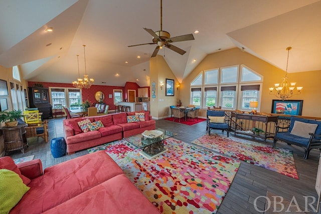 living area featuring ceiling fan with notable chandelier, high vaulted ceiling, and dark wood-type flooring