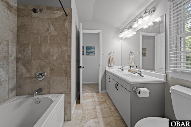 full bathroom with a sink, lofted ceiling, toilet, and shower / bathtub combination