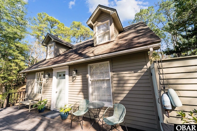 rear view of house with a wooden deck