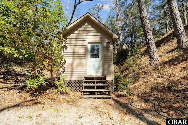 view of outbuilding featuring an outbuilding and entry steps