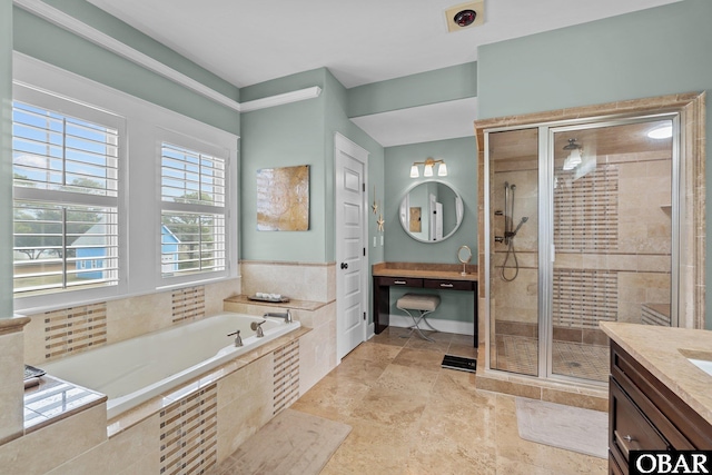 bathroom with a garden tub, a shower stall, and vanity