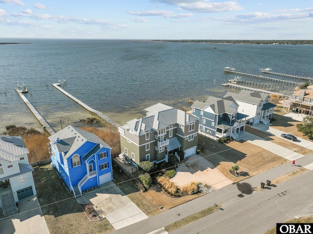 aerial view featuring a residential view and a water view